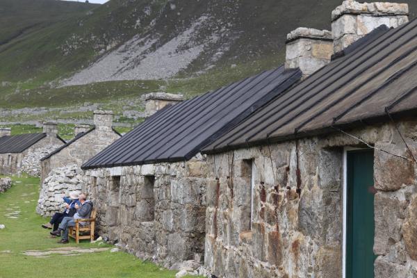 Some temporary visitors in the "high street".
Many of the buildings have been refurbished to permit use by the islands wardens and museum.
No phone signal, no internet. Only comms is by medium wave radio and all supplies come in by boat 
( when possible!!).
All MOD construction workers arrive by helicopter in the morning and leave at night.