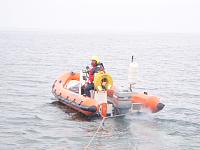 Towing a fishing boat to safety