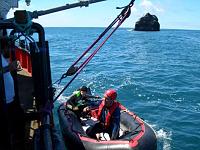 Coming alongside with climber Rockall expedition 2005. 
Note the home made crane made from stuff we found in the harbor skip for launch and recovery