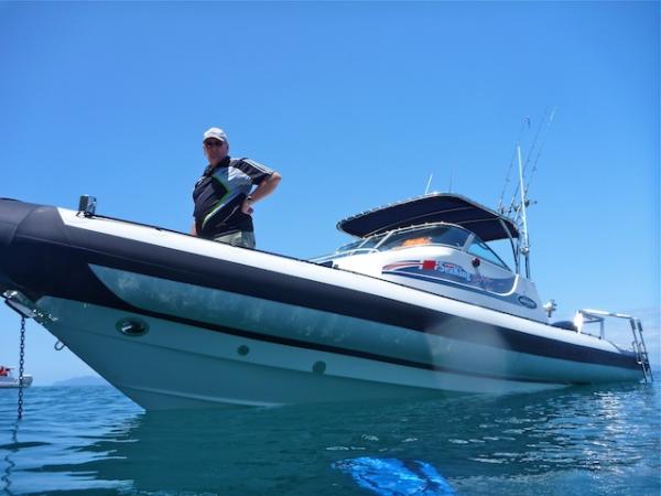 A proud owner in pristine summer waters, off Coromandel coast, New Zealand, January 2011