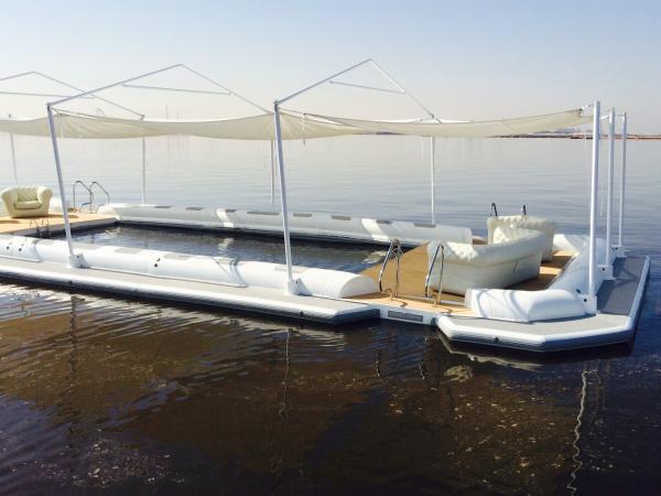 Inflatable floating island with "net protected"sea pool area, and even the furniture is inflatable, so no problem with storage space!! Recently built in our factory and delivered to client