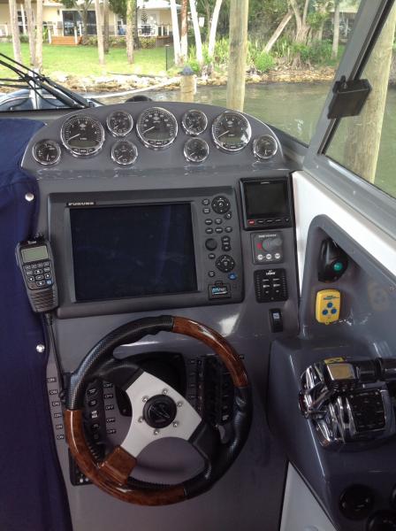 Helm station.  Garmin GHP 20 autopilot with Shadowdrive and Verado Smartpump system providing full integration with Furuno electronics and Mercury Verado engines.  Garmin permits operation of autopilot from anywhere on vessel.