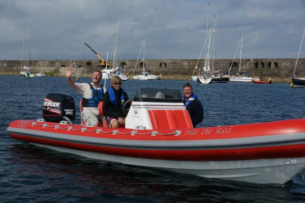 Us with Paul Cannel, Admiralty breakwater (Alderney) in the background