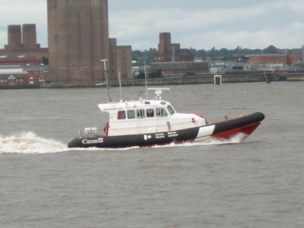 Beam shot of the RIB 'ENERGY' passing the Mersey tunnel air vent on the Birkenhead river.